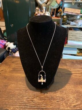 Sterling silver Bunny on a swing necklace.